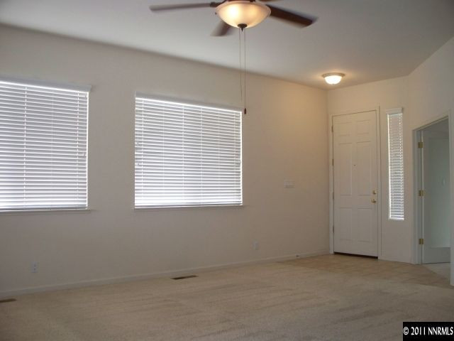 10065 Silver Star Drive Reno, NV 89521 - Photo 3 of 13 a view of an empty room with a window