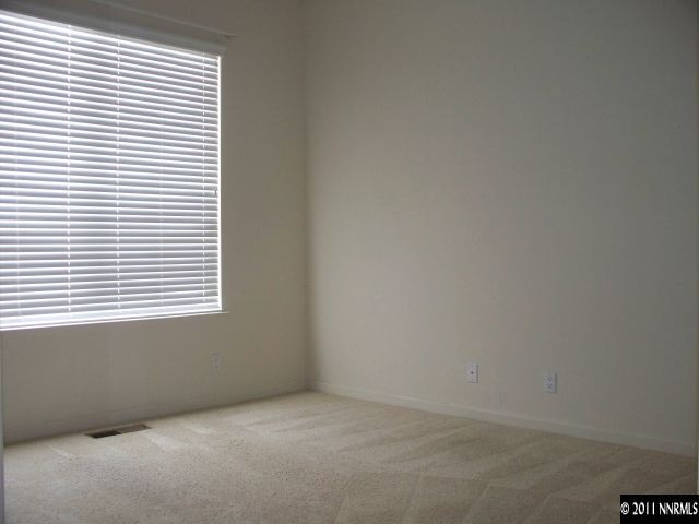 10065 Silver Star Drive Reno, NV 89521 - Photo 9 of 13 an empty room with a window