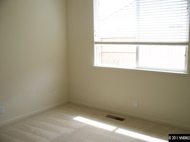10065 Silver Star Drive Reno, NV 89521 - Photo 10 of 13 an empty room with a window