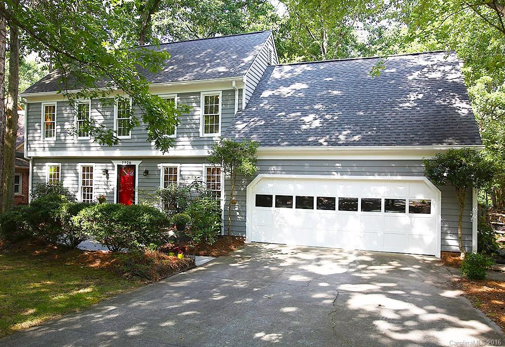 7226 Colony Road Charlotte, NC 28226 - Photo 1 of 24 a view of a large building with a yard and plants