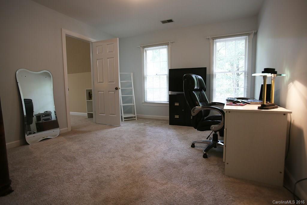 7226 Colony Road Charlotte, NC 28226 - Photo 16 of 24 a view of a workspace with furniture and a window