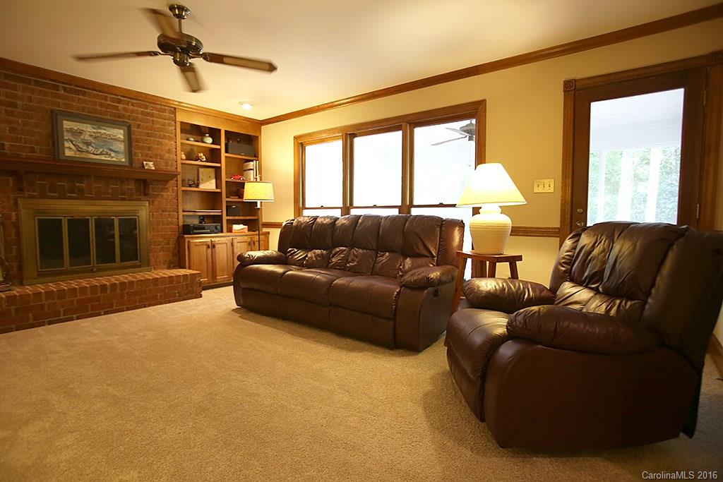 7226 Colony Road Charlotte, NC 28226 - Photo 6 of 24 a living room with furniture and a fireplace