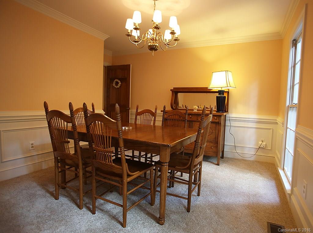 7226 Colony Road Charlotte, NC 28226 - Photo 8 of 24 a view of a dining room with furniture and chandelier