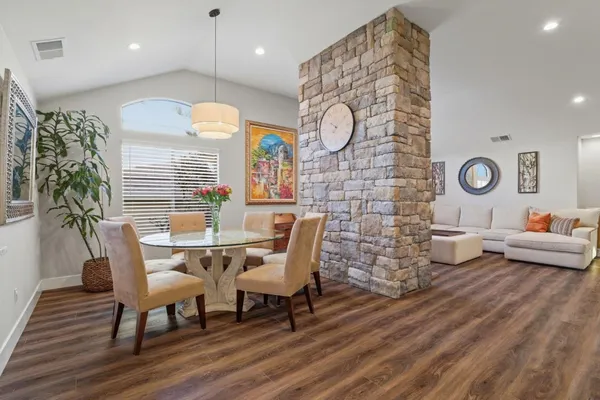 a large kitchen with a table and chairs in it