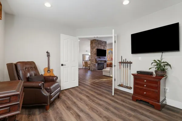 a spacious bedroom with a bed and dresser