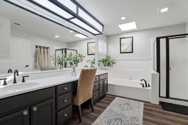 a bathroom with bathtub and shower