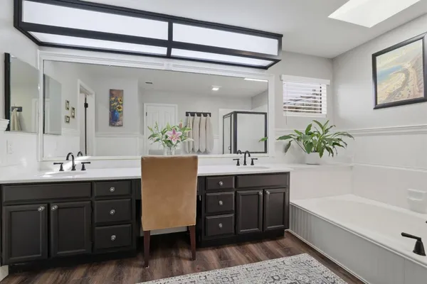 a bedroom with a bed and a night stand