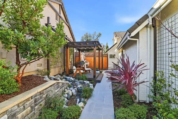 a view of an house with backyard porch and patio