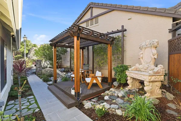 a front view of a house with garden