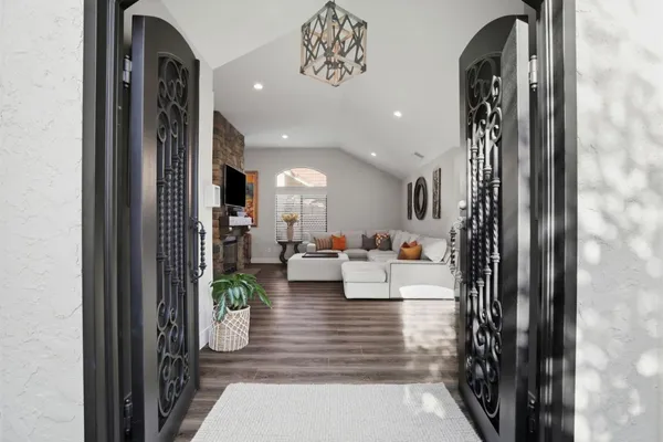 a living room with furniture a fireplace and a flat screen tv