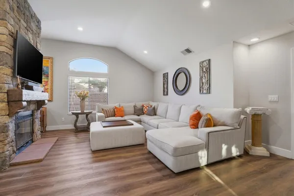 a living room with furniture and a large window