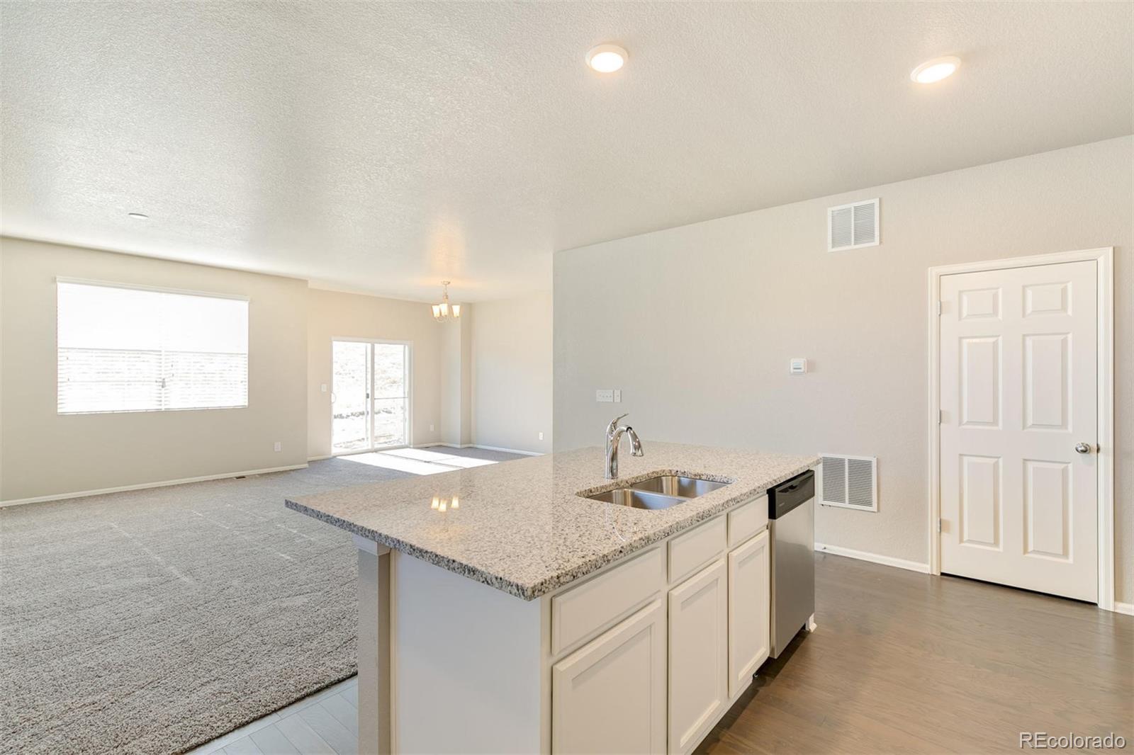 925 Camberly Drive Windsor, CO 80550 - Photo 15 of 29 a bathroom with a granite countertop sink and mirror