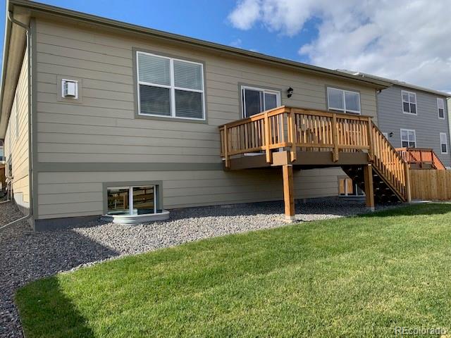 925 Camberly Drive Windsor, CO 80550 - Photo 29 of 29 a view of a house with a yard