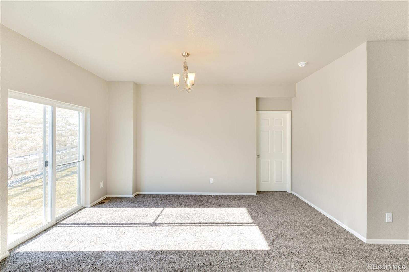 925 Camberly Drive Windsor, CO 80550 - Photo 8 of 29 a view of entryway with kitchen