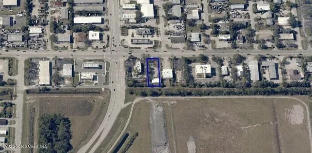 an aerial view of a building with street view