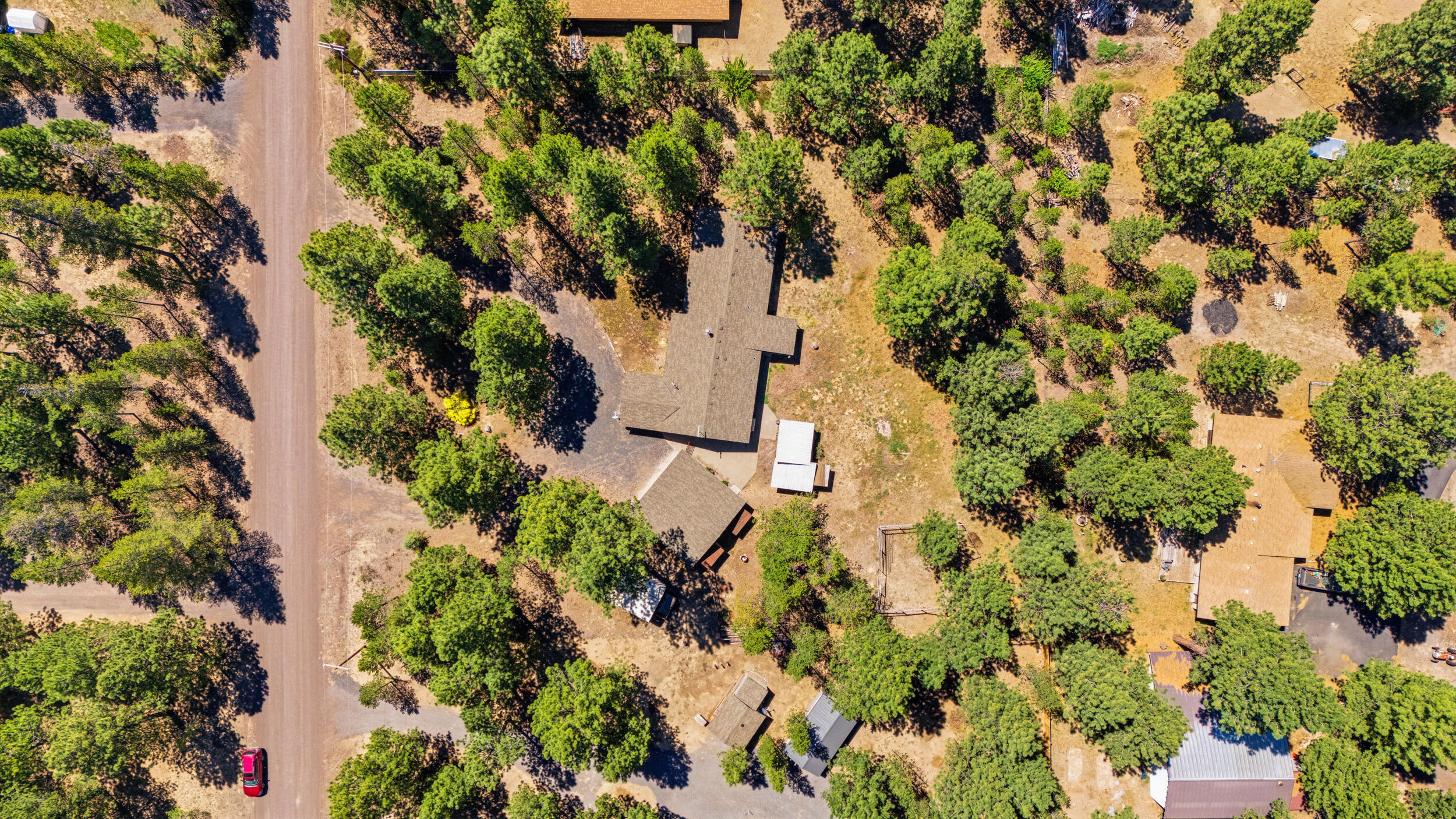 50868 Doe Loop La Pine, OR 97739 - Photo 49 of 51 an aerial view of residential house with parking space and trees around