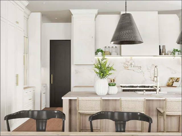 a table with white cabinets and potted plant