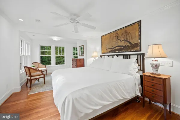 a bed room with a bed and a night stand