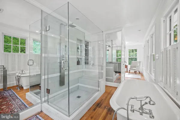 a bathroom with a shower and a sink