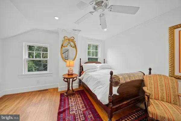 a bedroom with a bed and a lamp