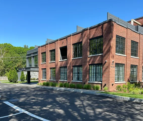 a view of a building with a yard