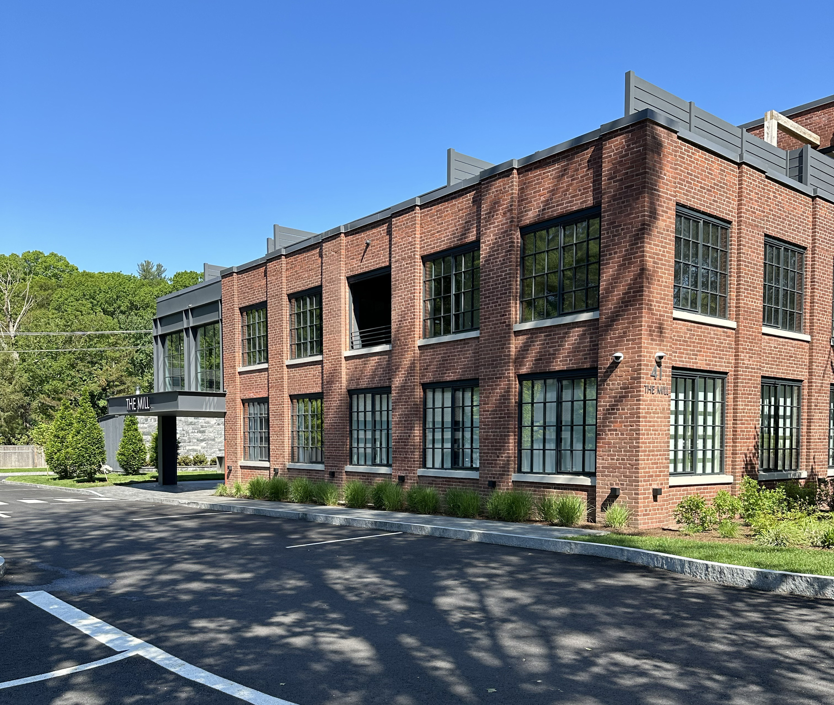 a view of a building with a yard