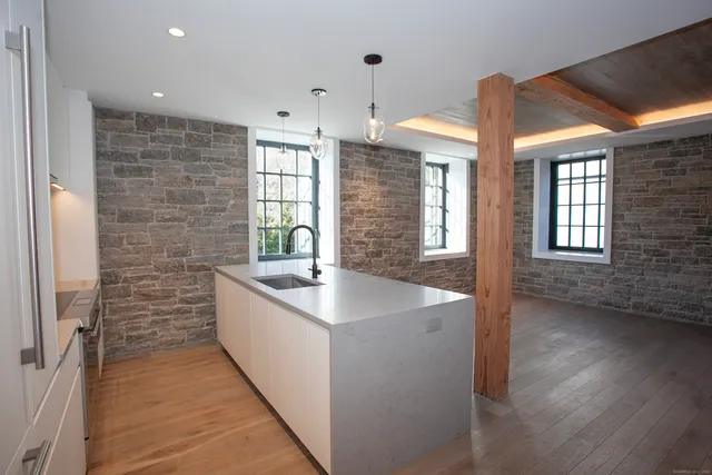 a view of kitchen with wooden floor
