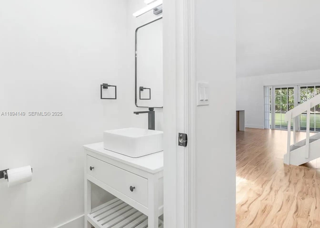 6850 Northwest 2nd Avenue, Unit 34 Boca Raton, FL 33487 - Photo 5 of 23 a bathroom with a sink and a mirror