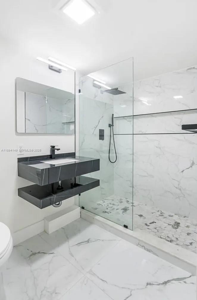 6850 Northwest 2nd Avenue, Unit 34 Boca Raton, FL 33487 - Photo 9 of 23 a bathroom with a tub sink and mirror