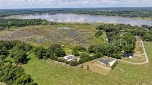a view of a lake with a yard