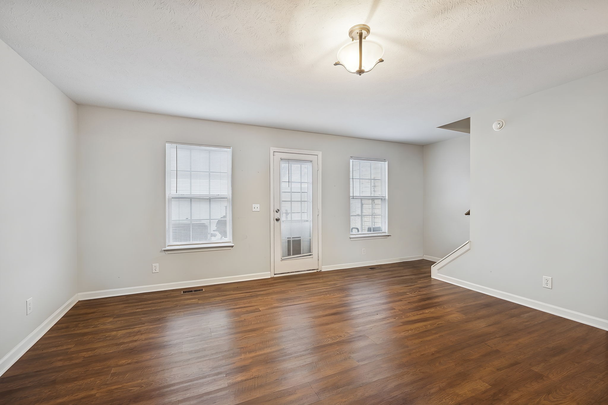 1036 Wolves Den Place Murfreesboro, TN 37128 - Photo 10 of 15 an empty room with wooden floor and windows