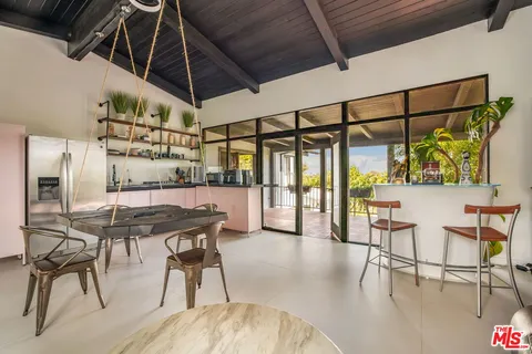 a view of a chairs and table in a patio