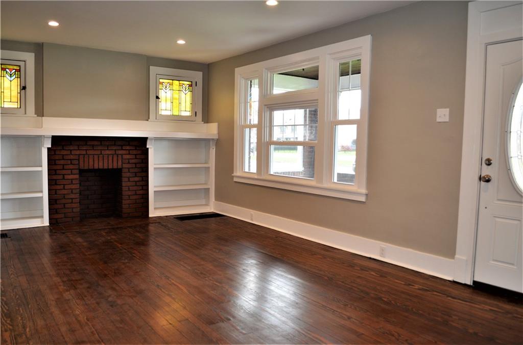 1317 Freeport Road Natrona Heights, PA 15065 - Photo 5 of 24 Beautiful refinished hardwood, stained glass windows and built in book cases add to this homes charm and character!
