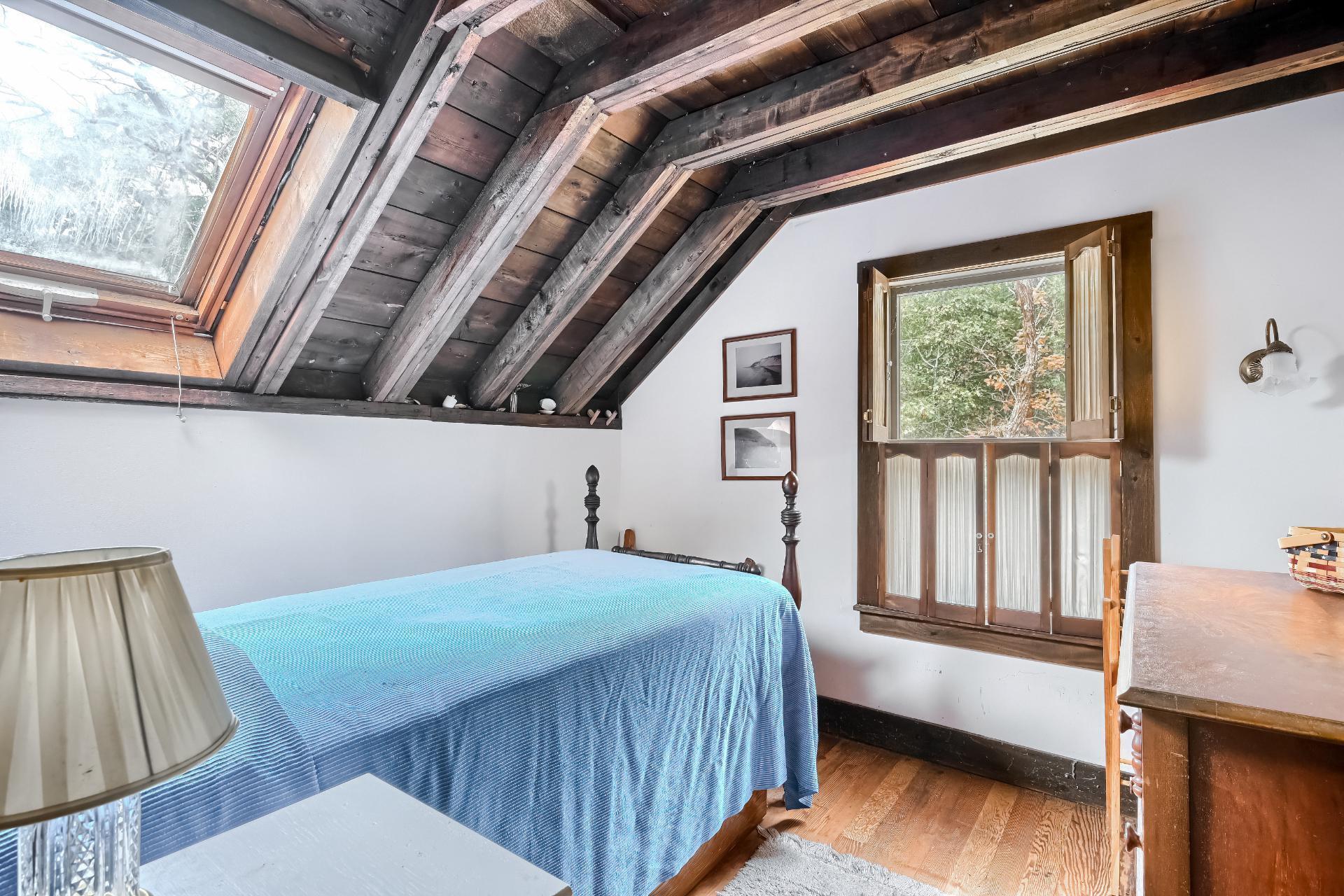 500 Gull Pond Road Wellfleet, MA 02667 - Photo 38 of 62 a bedroom with a bed and wooden floor