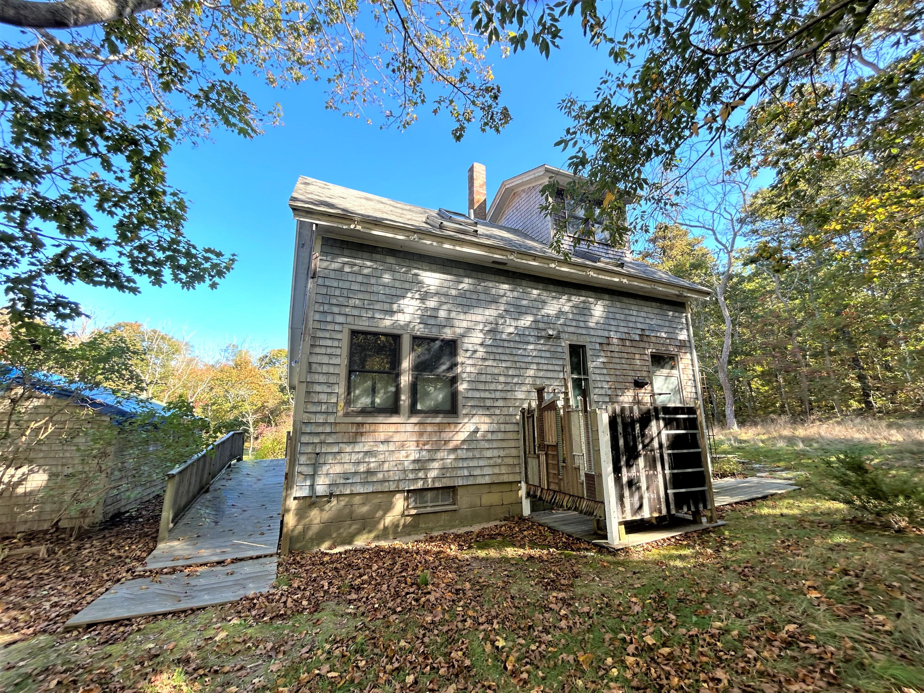 500 Gull Pond Road Wellfleet, MA 02667 - Photo 45 of 62 a front view of a house with garden