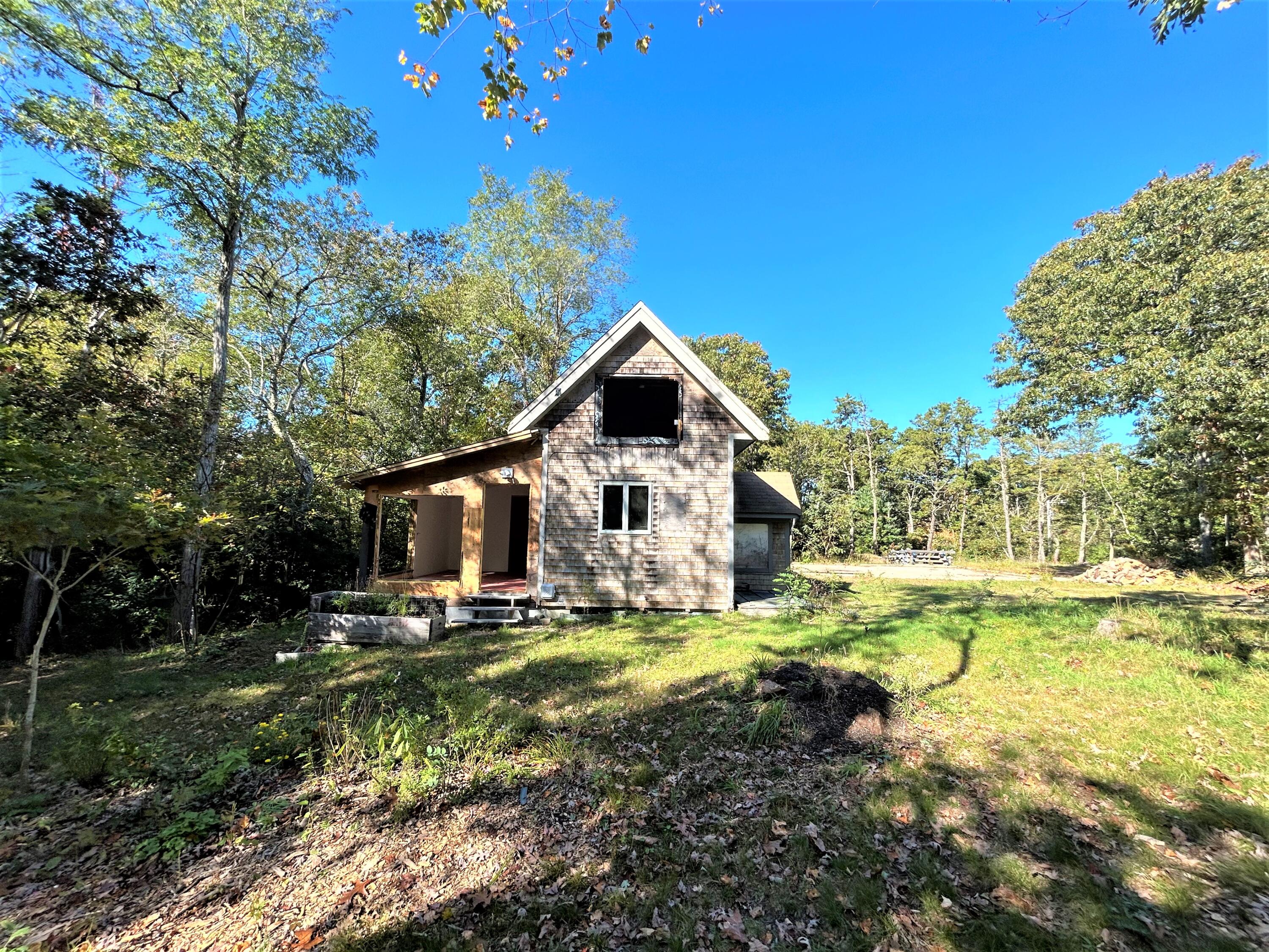 500 Gull Pond Road Wellfleet, MA 02667 - Photo 51 of 62 a front view of house with yard and swimming pool
