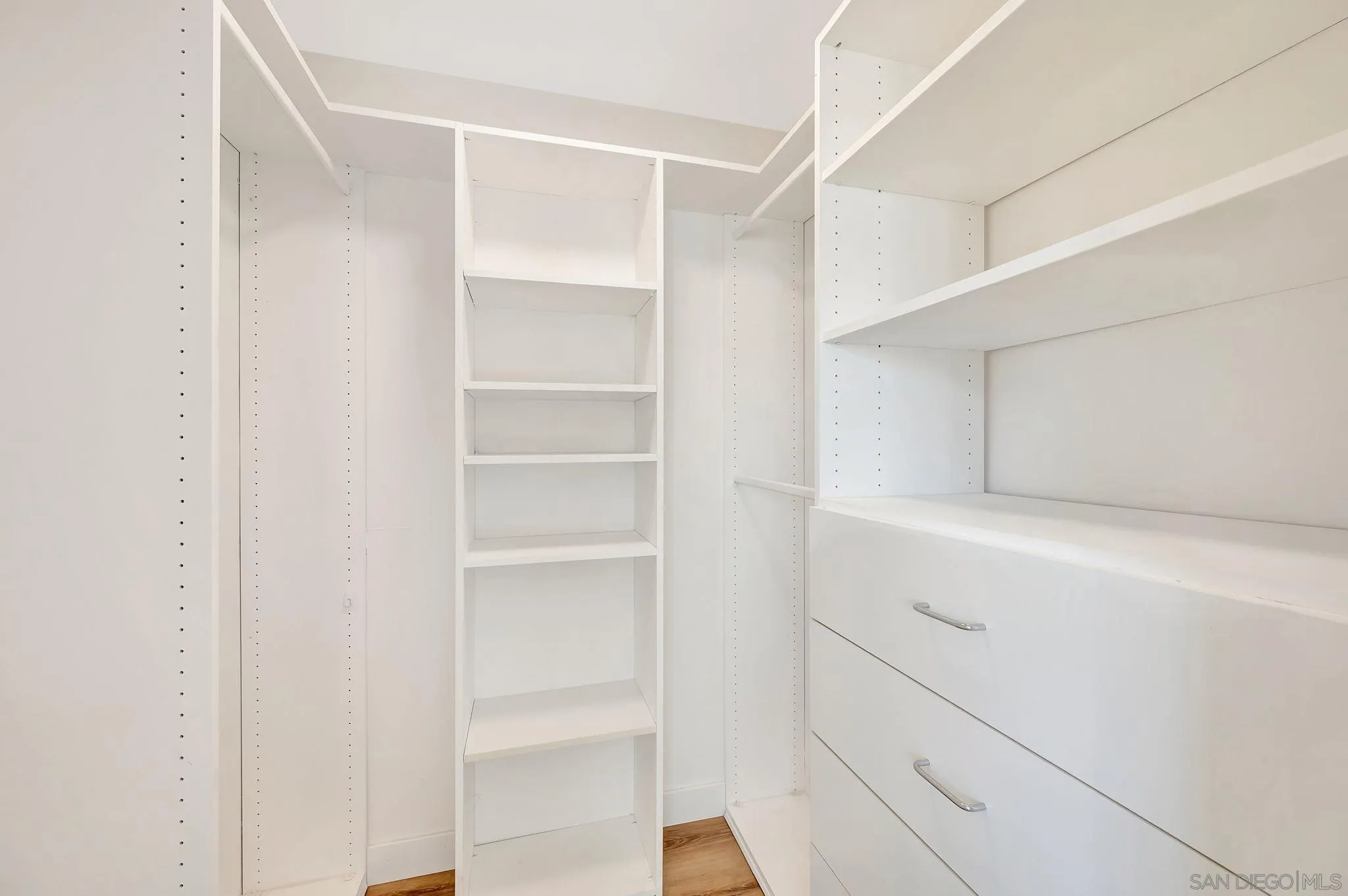 9421 Avenida Acero Spring Valley, CA 91977 - Photo 21 of 47 a view of walk in closet with empty racks