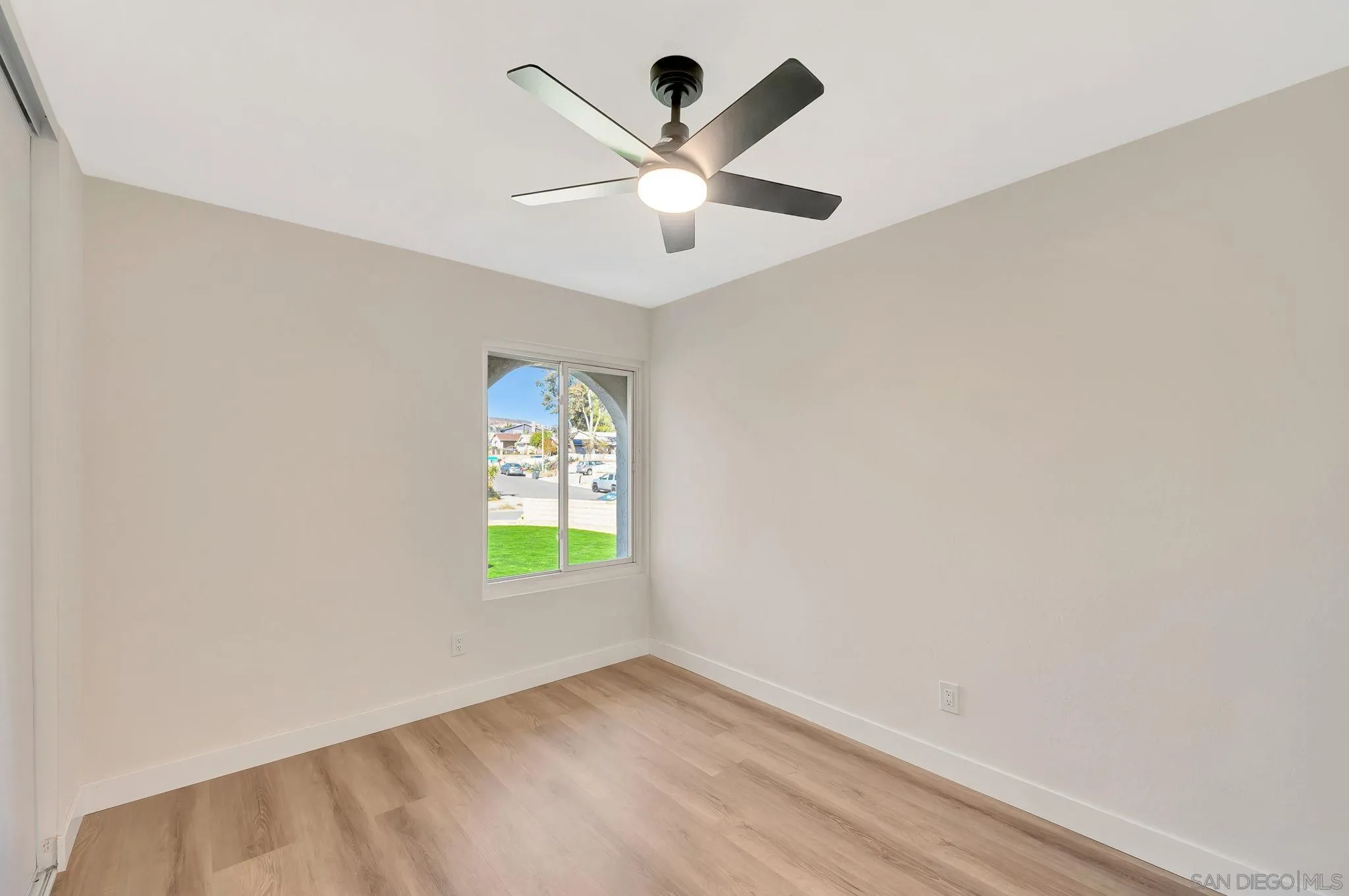 9421 Avenida Acero Spring Valley, CA 91977 - Photo 26 of 47 an empty room with window and ceiling fan