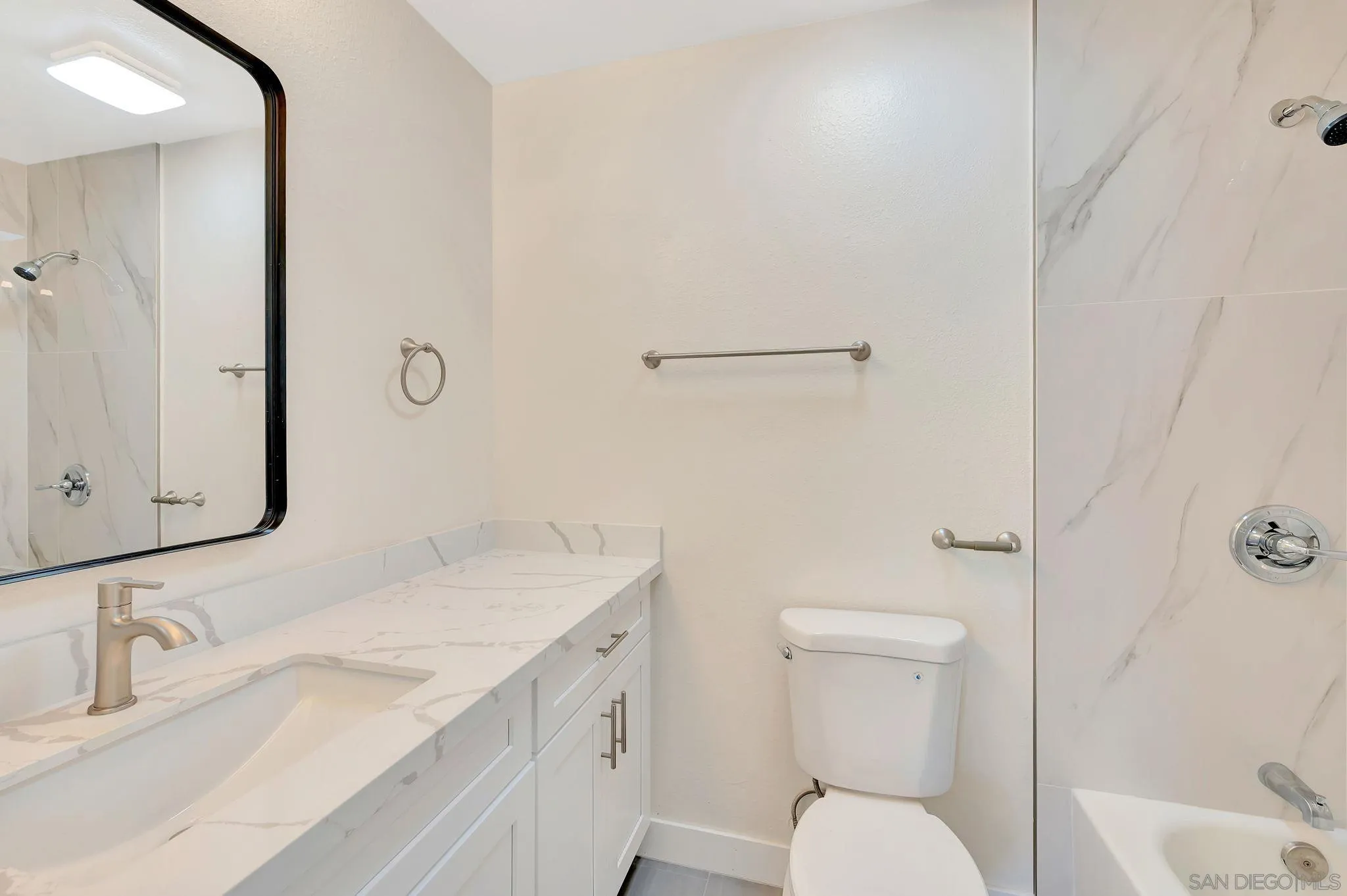 9421 Avenida Acero Spring Valley, CA 91977 - Photo 28 of 47 a bathroom with a sink toilet and shower