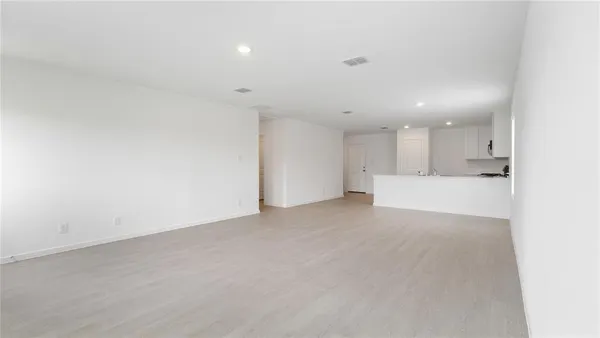 a kitchen with a stove a sink and a microwave