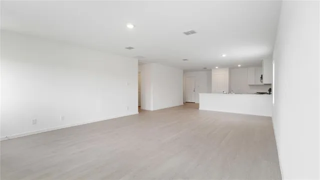 a kitchen with a stove a sink and a microwave