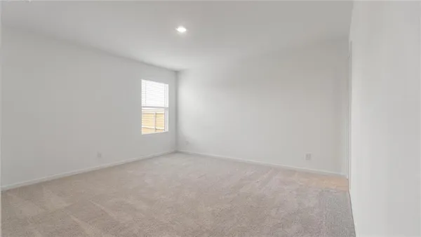 a kitchen with a sink and a stove top oven with wooden floor