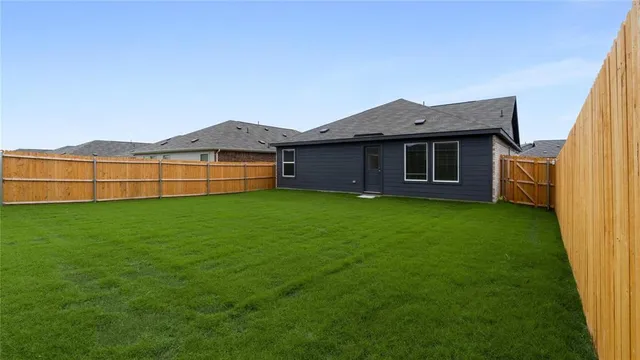 a view of a backyard of a house