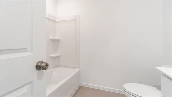 a bathroom with a sink toilet and vanity