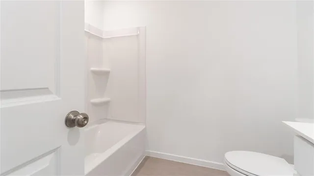 a bathroom with a sink toilet and vanity