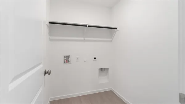 a white toilet sitting next to a white sink