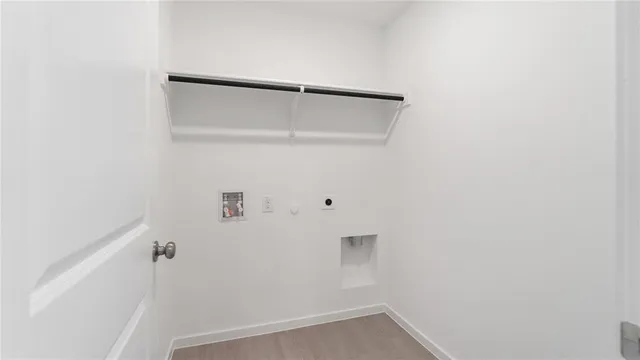 a white toilet sitting next to a white sink