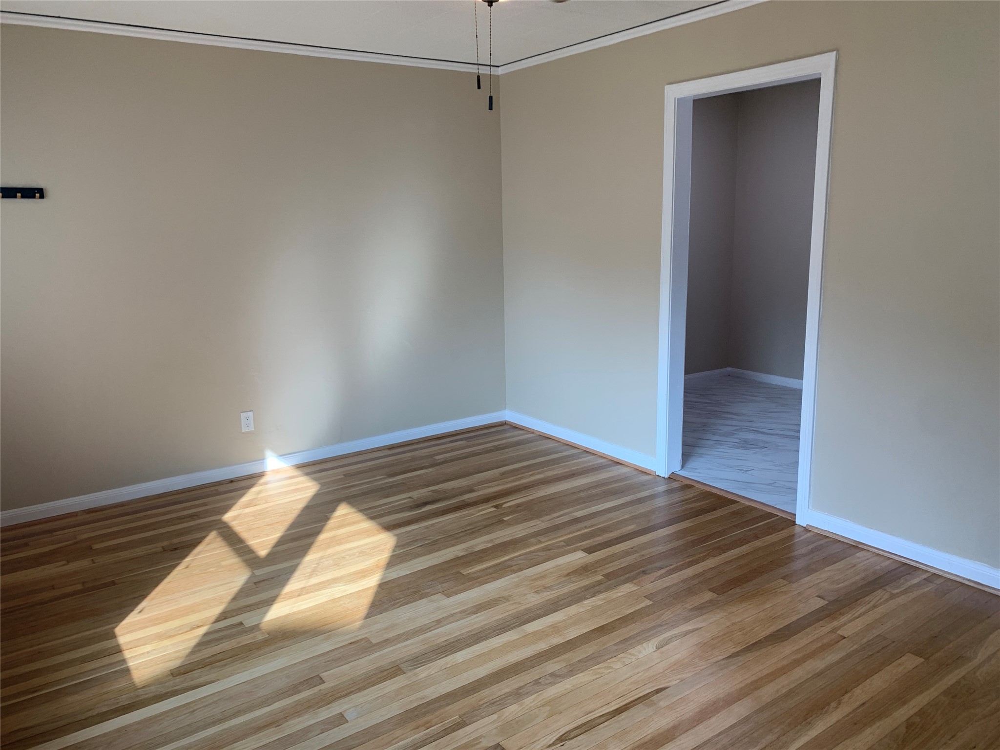 307 Avondale Street, Unit 1 5 Houston, TX 77006 - Photo 5 of 20 a view of a room with wooden floor and closet