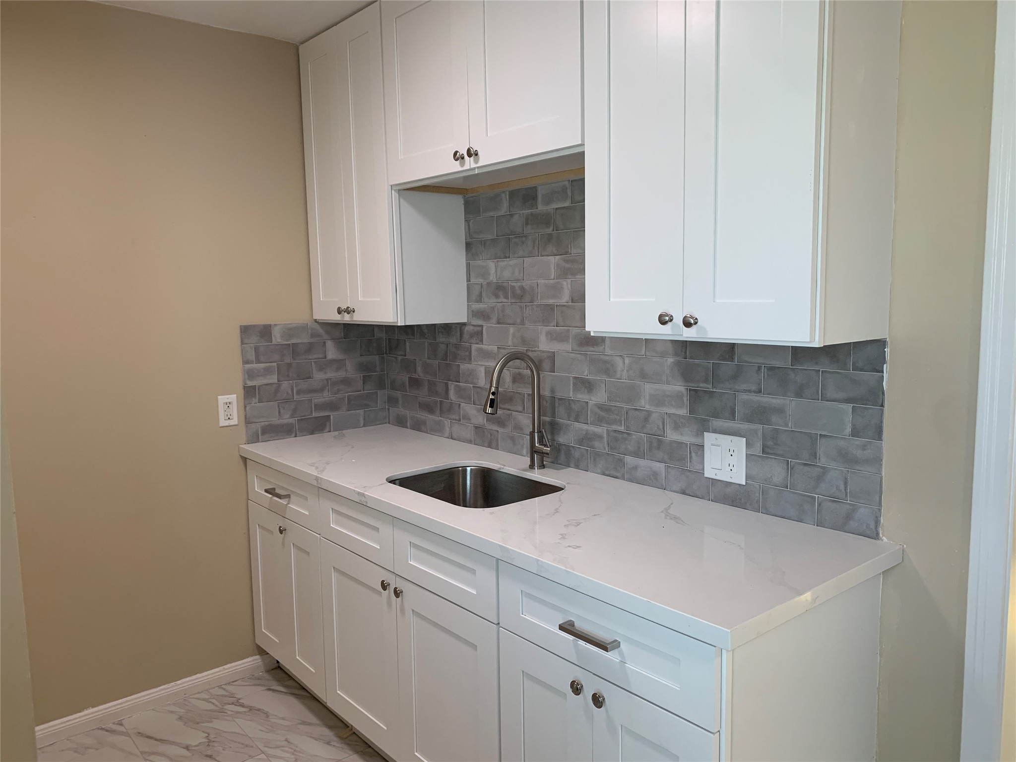 307 Avondale Street, Unit 1 5 Houston, TX 77006 - Photo 7 of 20 a view of a kitchen with white cabinets