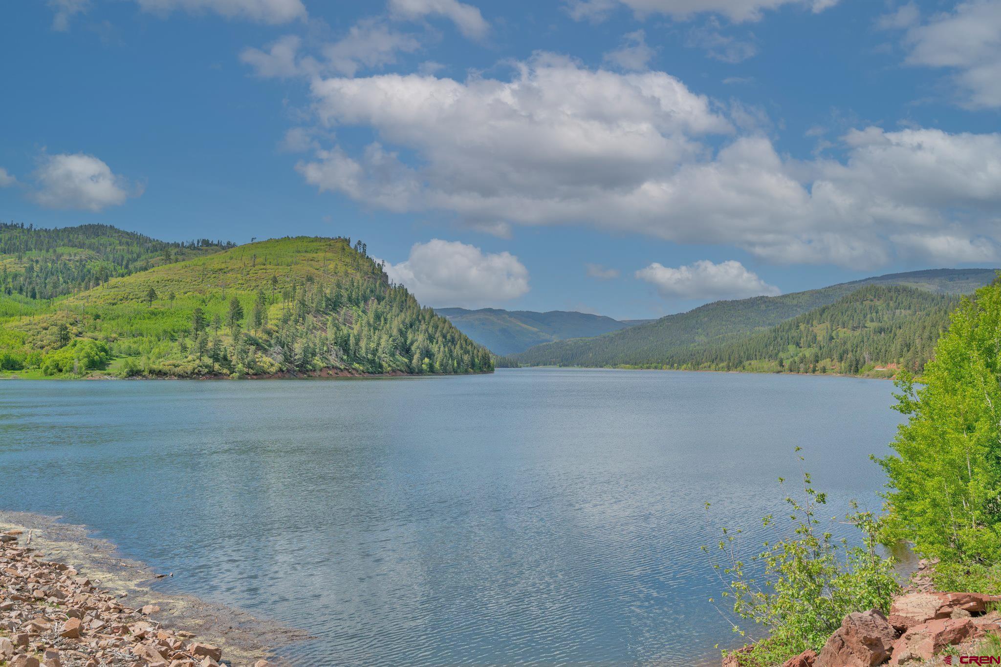 1515 County Road 243 Durango, CO 81301 - Photo 15 of 43 a view of a lake in front of the house